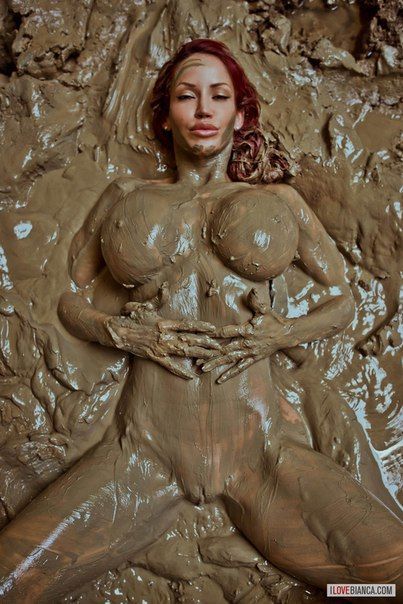 Nude girls covered in mud