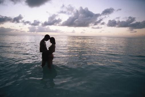 Couples sex in ocean