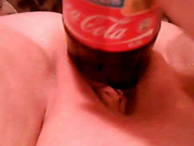 Chick with coke pottle in pussy
