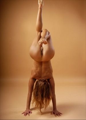 Female naked hand stands
