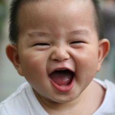 Asian baby laughing