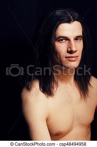Man with long dark hair naked