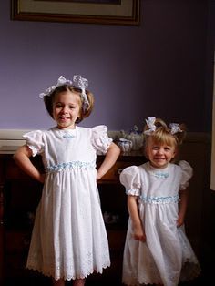 Girls in white dresses with blue