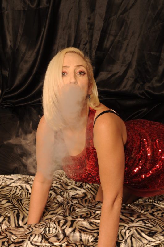Sexy girl blowing smoke from pussy photo photo